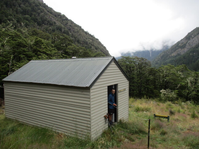 Top Gordon Hut, Leatham Conservation Area  by mountain-mule-memories. - The hut with the valley in the background. Late January, 2025